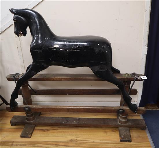 A Lines Brothers Ltd Sportiboy black rocking horse, on tressle underframe, early 20th century, L.135cm